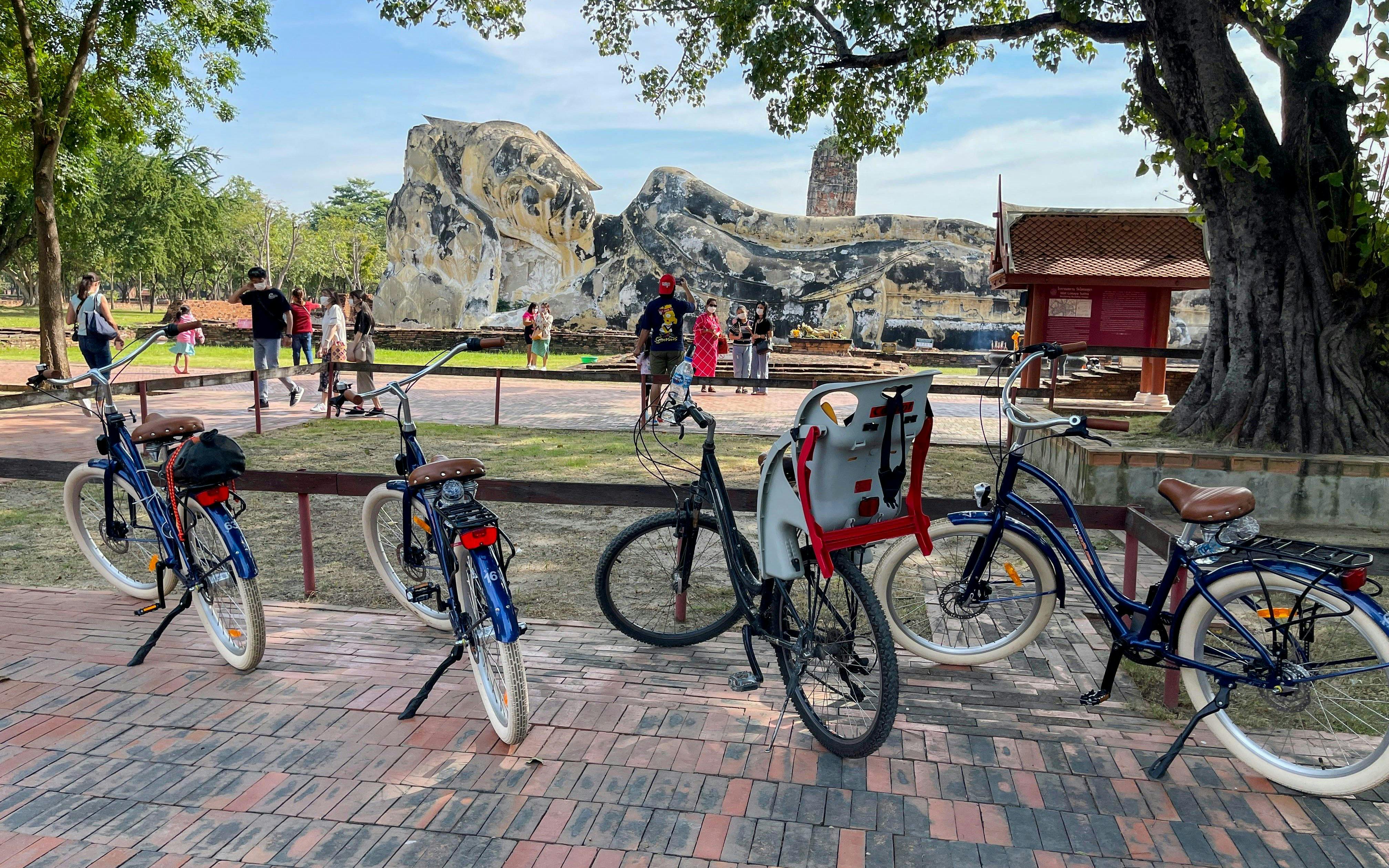 Bicycles parked near the Reclining Buddha statue in Ayutthaya, Thailand.