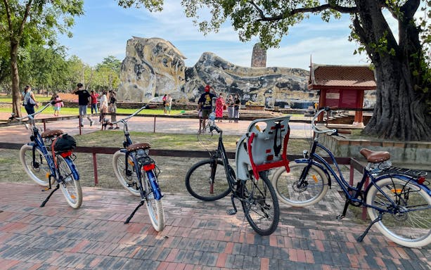 Bicycles parked near the Reclining Buddha statue in Ayutthaya, Thailand.