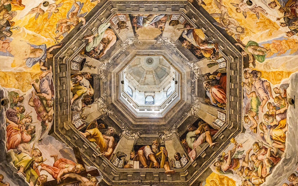 Artwork inside the dome of the Duomo in Florence, Italy, depicting religious figures and scenes.