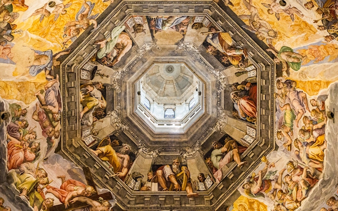 Artwork inside the dome of the Duomo in Florence, Italy, depicting religious figures and scenes.