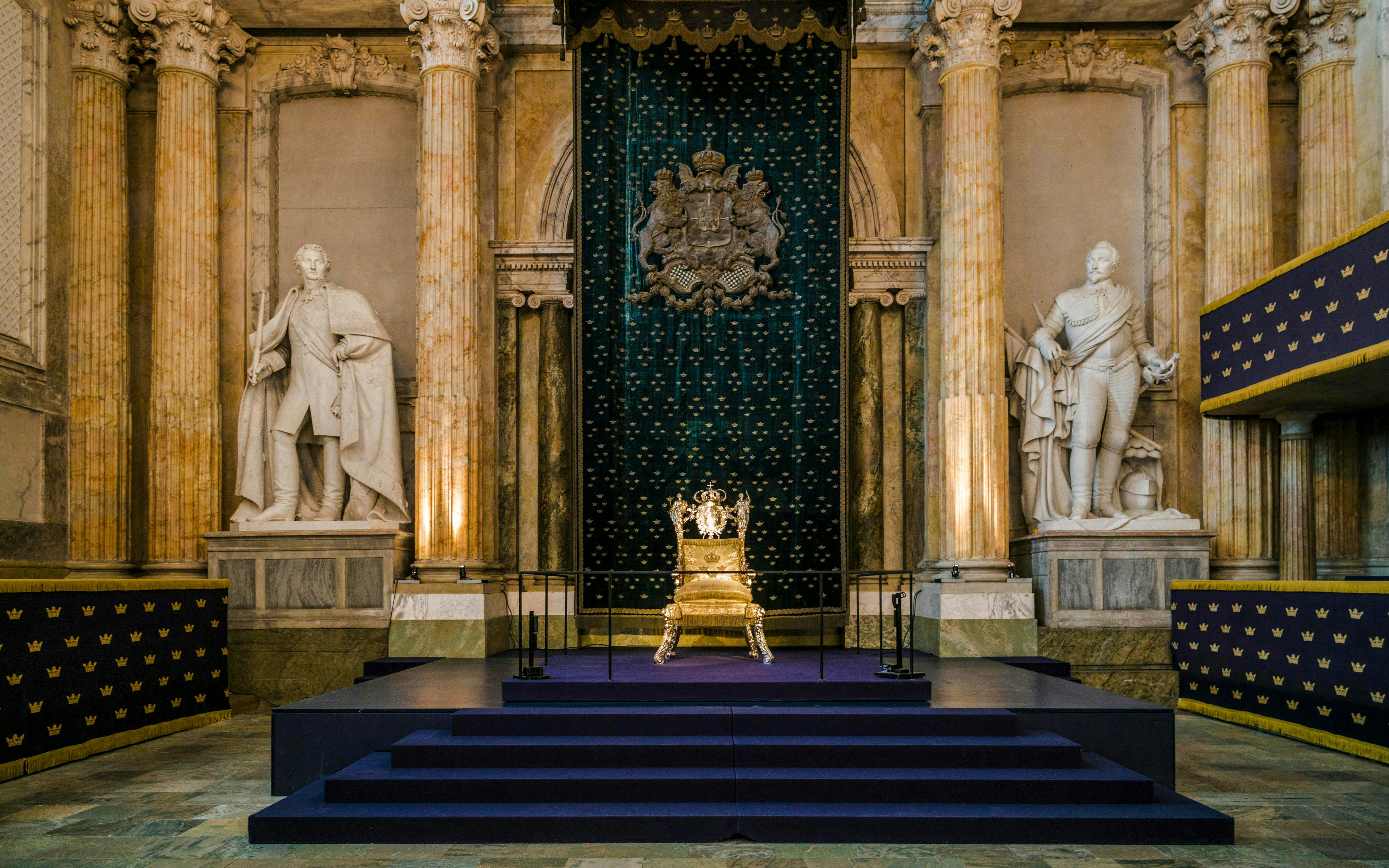 Throne room interior at Stockholm Royal Palace with ornate golden throne.