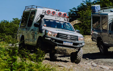 4x4 vehicle navigating rugged terrain on Lakes Escondido and Fagnano tour.