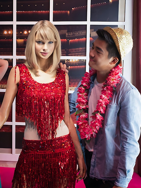 Tourists posing with a wax figure at Madame Tussauds Singapore.