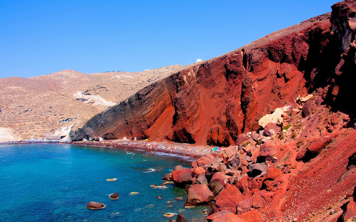 Red Beach in Santorini with red cliffs and turquoise water.