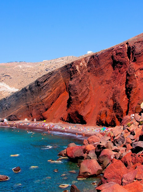 Red Beach in Santorini with red cliffs and turquoise water.