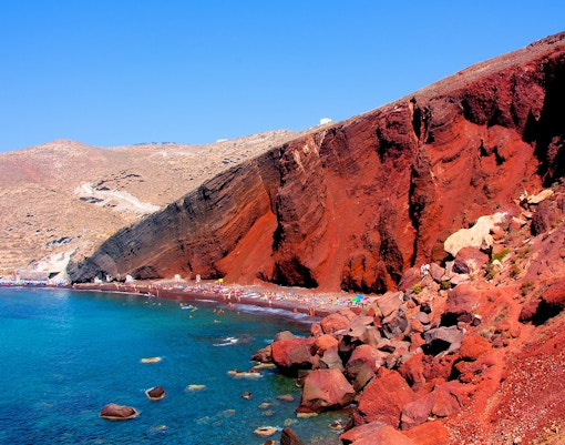 Red Beach in Santorini with red cliffs and turquoise water.