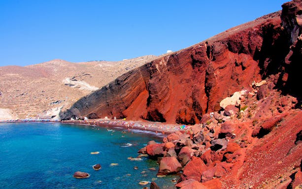 Red Beach in Santorini with red cliffs and turquoise water.