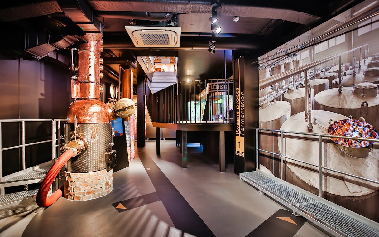 Slivovitz Museum interior with distillation equipment and fermentation display.