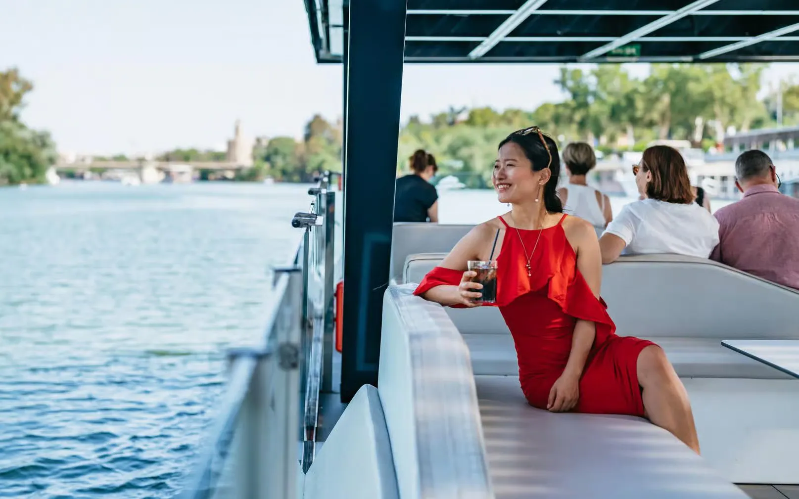 Tourist enjoying Eco-Friendly Guadalquivir River Cruise in Seville, Spain.