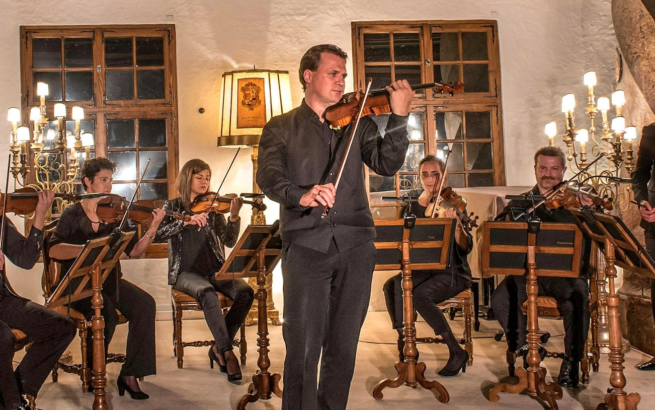 Musicians playing violins at Mozart concert in Fortress Hohensalzburg, Salzburg.