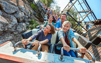 Visitors enjoying a roller coaster ride at PortAventura.