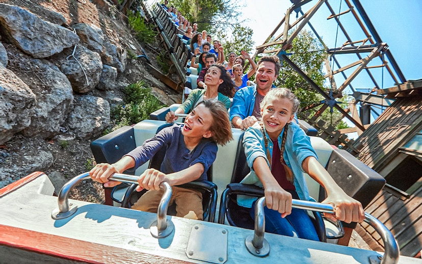 Visitors enjoying a roller coaster ride at PortAventura.