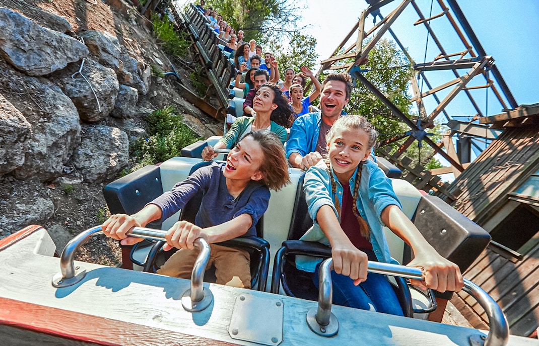 PortAventura theme park roller coaster in Salou, Spain, with vibrant loops and tracks.