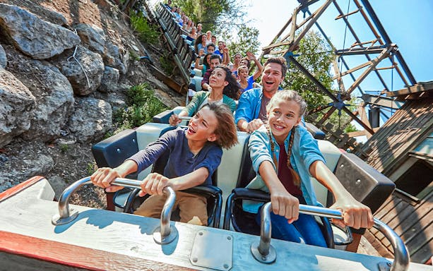 Visitors enjoying a roller coaster ride at PortAventura.