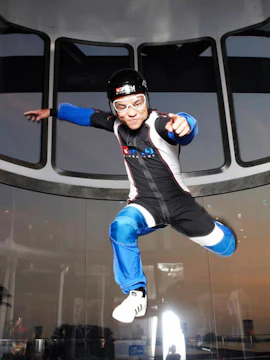 Person experiencing indoor skydiving at iFly Singapore.