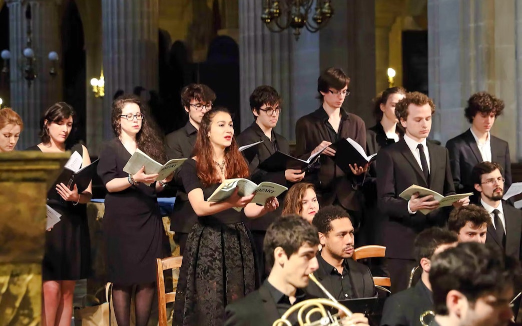 Choir performing with orchestra in St Sulpice Church, Paris.