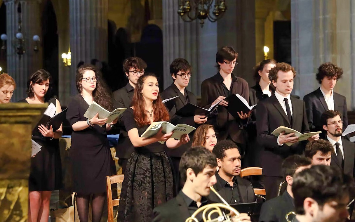 Choir performing with orchestra in St Sulpice Church, Paris.