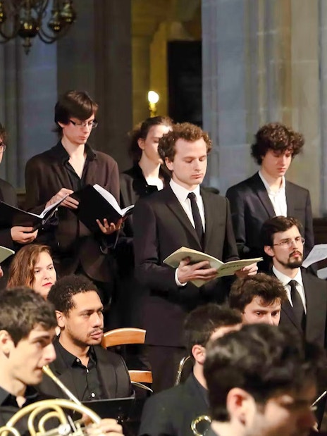 Choir performing with orchestra in St Sulpice Church, Paris.