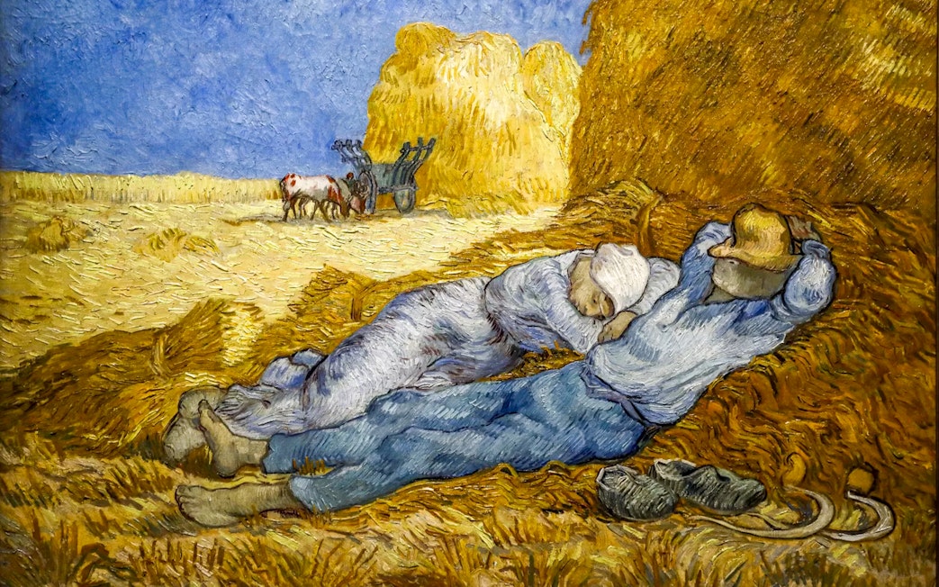 Two figures resting on haystacks in a field, with a cart and oxen in the background, from Van Gogh's work.