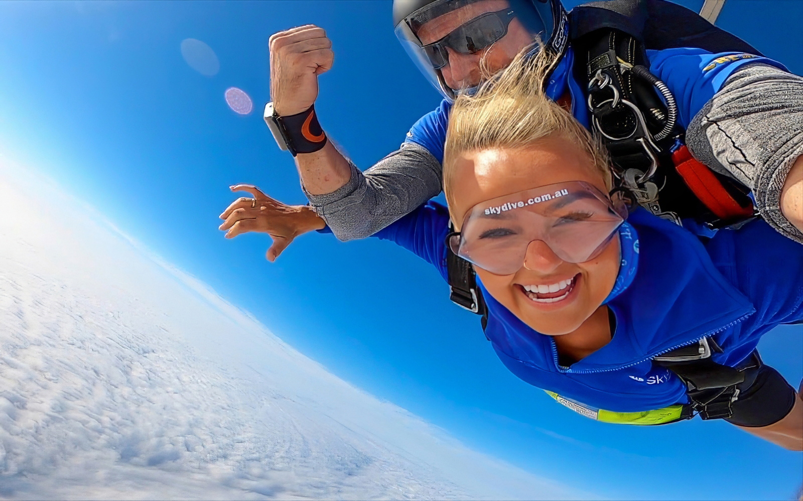 Tandem skydiving over Newcastle, Australia with woman and instructor.