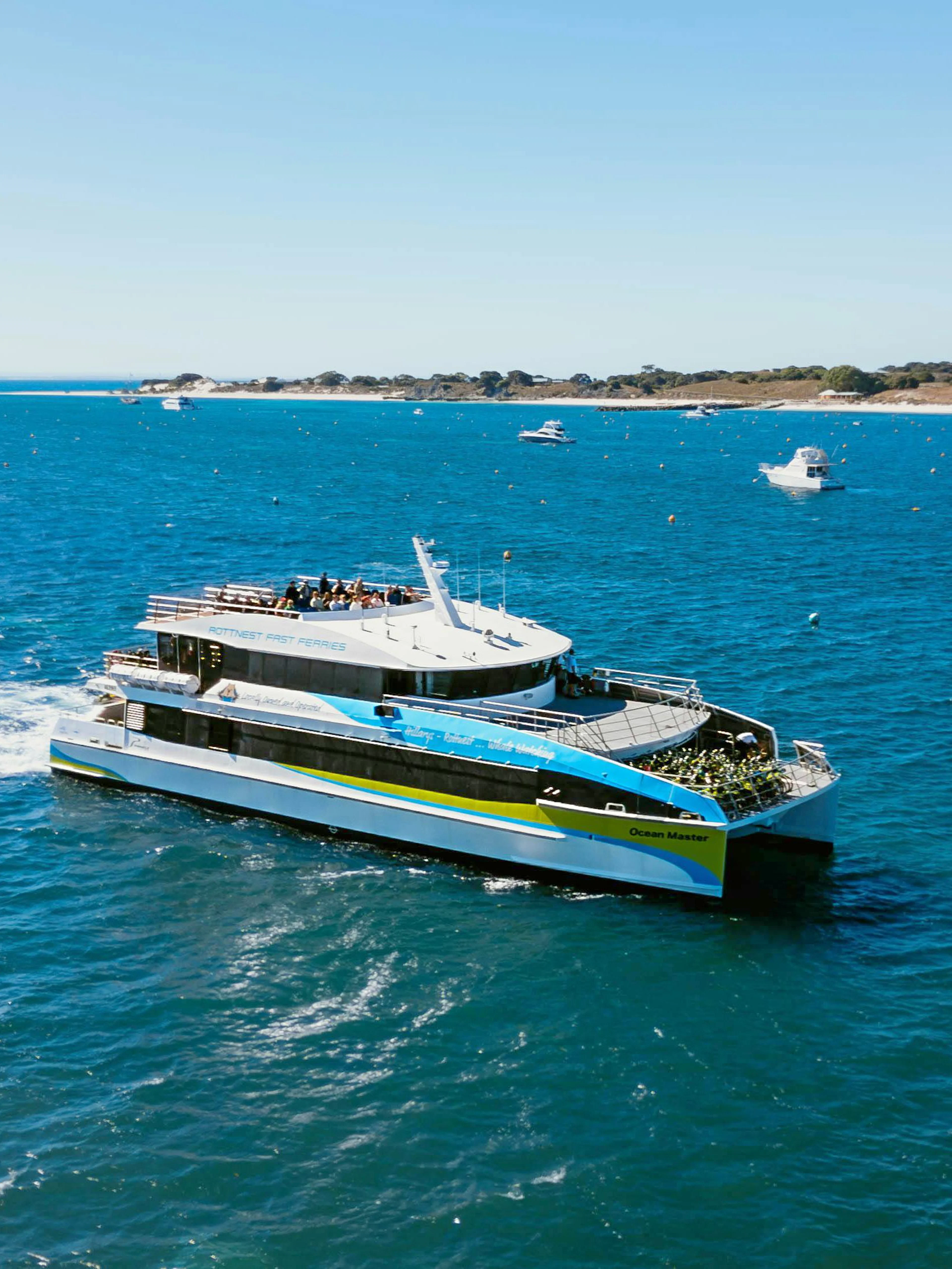 Ferry traveling from Hillarys to Rottnest Island across blue ocean waters.