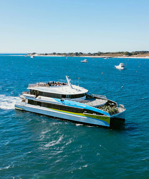 Ferry traveling from Hillarys to Rottnest Island across blue ocean waters.