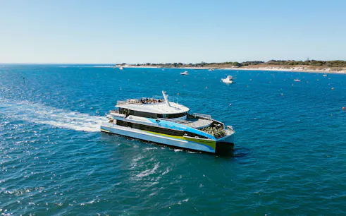 Ferry traveling from Hillarys to Rottnest Island across blue ocean waters.