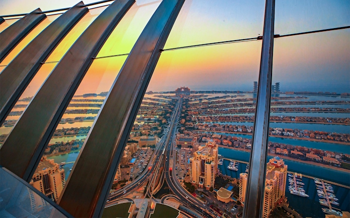 View of The Palm Jumeirah from Burj Khalifa At The Top, showcasing the iconic island layout.