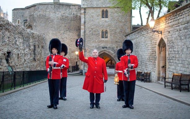 Guards at Tower of London during the Ceremony of the Keys, holding lanterns and rifles.