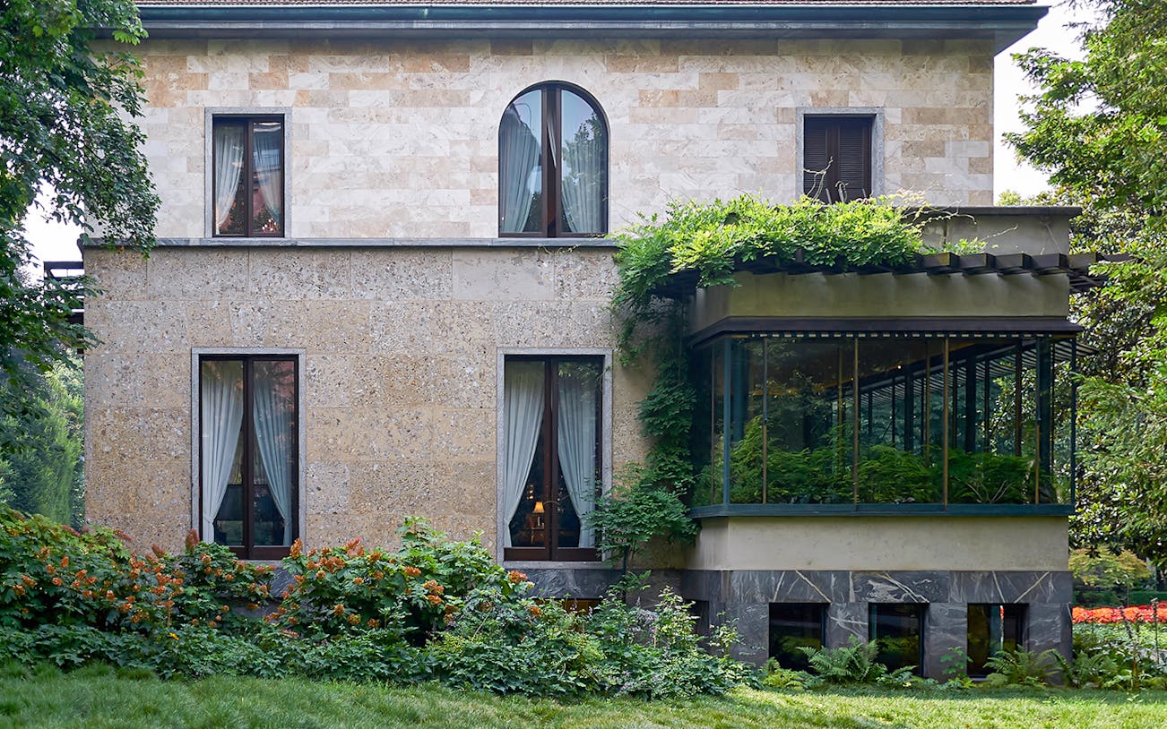 Villa Necchi Campiglio exterior with lush garden, Milan, Italy.