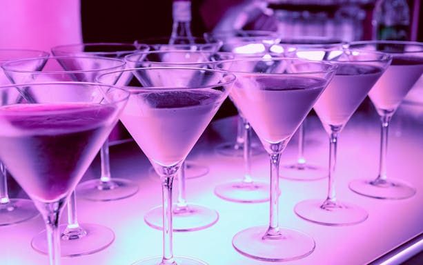 Cocktails on a bar counter at CRAZY LAND Osaka Nightclub.