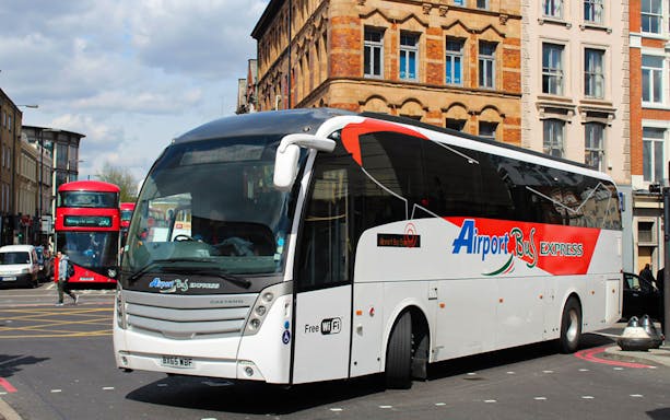 Shuttle bus at London Stansted Airport terminal for round-trip to London Stratford.