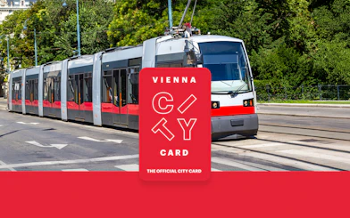 Tram in Vienna with Vienna City Card logo for unlimited transport and discounts.