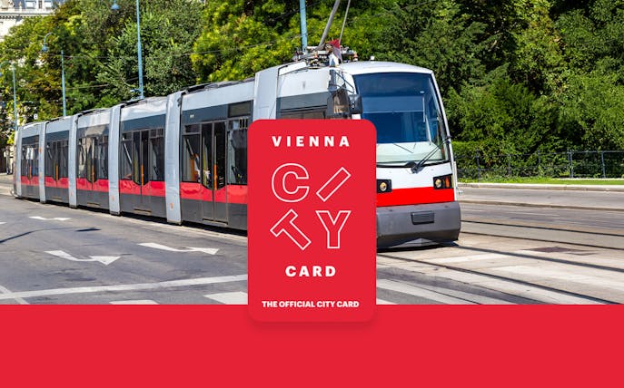 Tram in Vienna with Vienna City Card logo for unlimited transport and discounts.