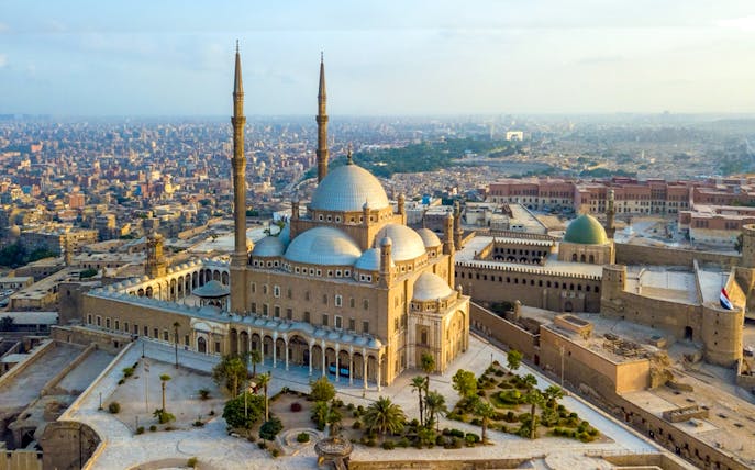 Saladin Citadel in Cairo with cityscape in the background.