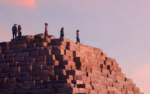 Guests atop pyramid stones during Horizon of Khufu tour in Egypt.
