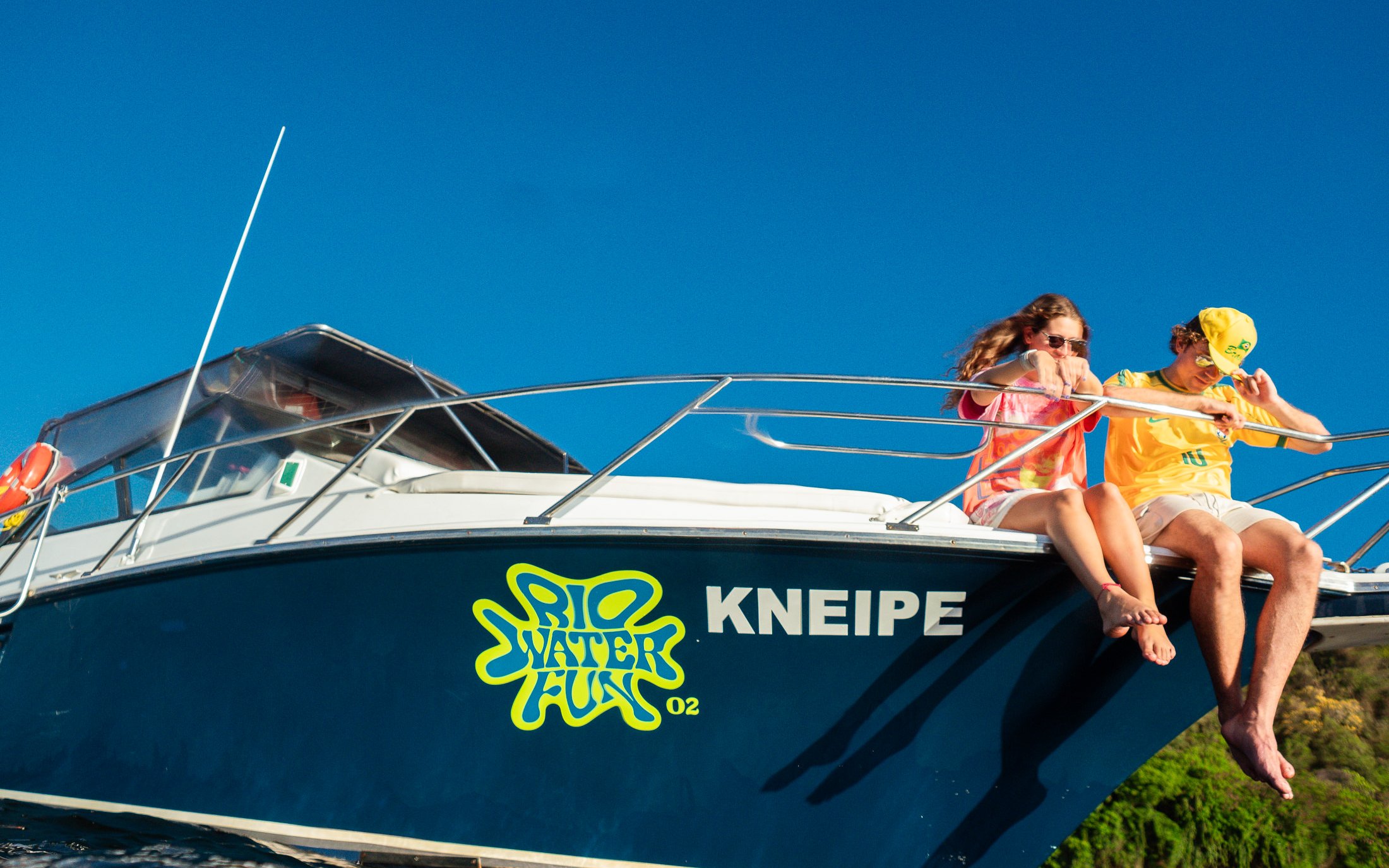 Tourists on a boat enjoying a Rio de Janeiro excursion.