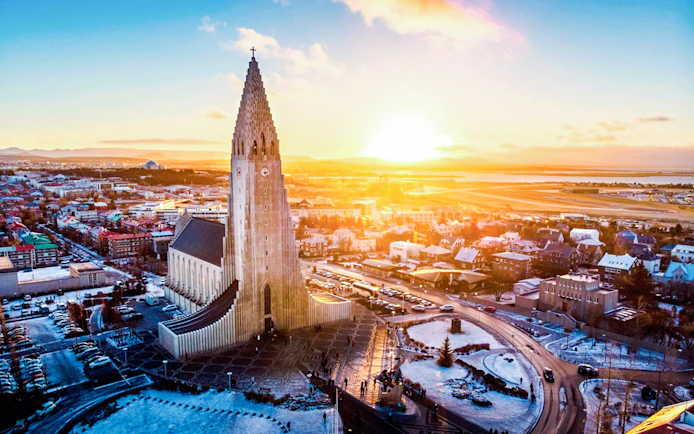 Hallgrímskirkja church in Reykjavik at sunrise, showcasing Iceland's architectural wonder.
