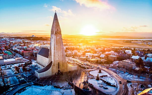 Hallgrímskirkja church in Reykjavik at sunrise, showcasing Iceland's architectural wonder.