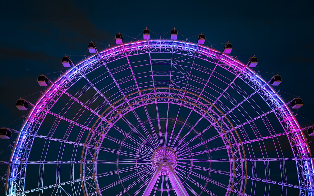 Ferris wheel illuminated at night, ICON Park, Orlando.