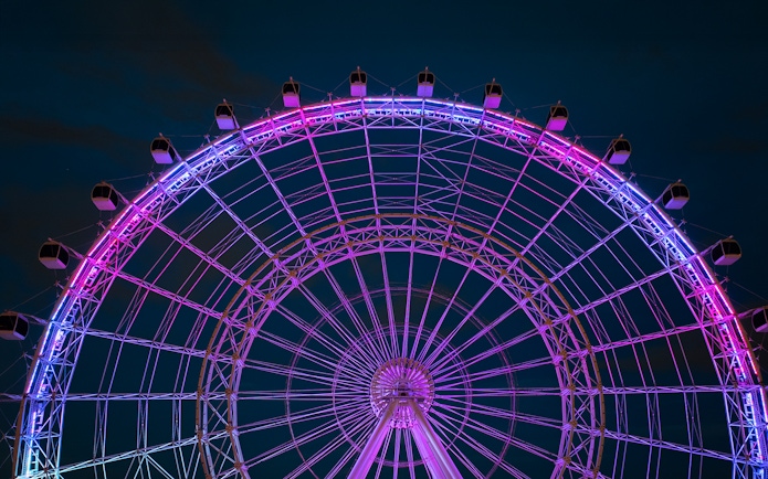 Ferris wheel illuminated at night, ICON Park, Orlando.
