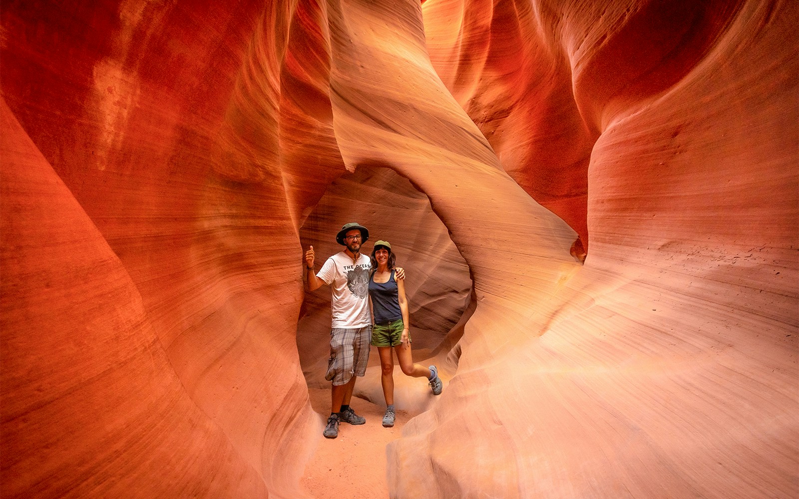 Visitors exploring the narrow sandstone walls of Antelope Valley Canyon on the Ligai Si Anii Tour.