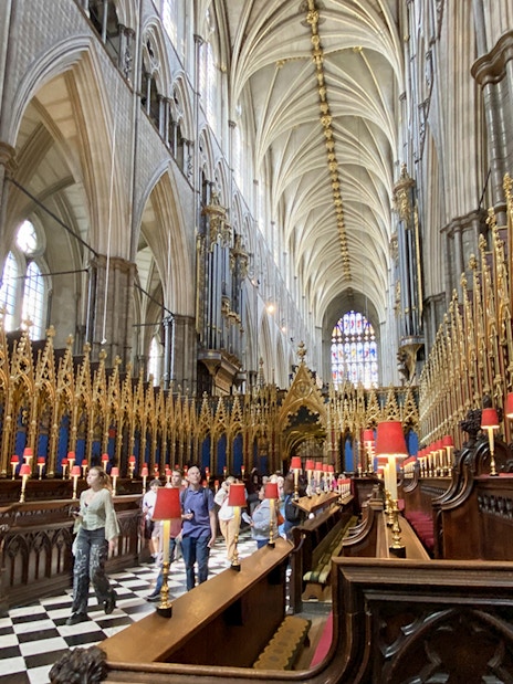 Tourists walking inside Westminster Abbey's Anglican Church, London.