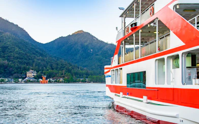 Ferry approaching Miyajima Island with view of Itsukushima Shrine's torii gate, Hiroshima.