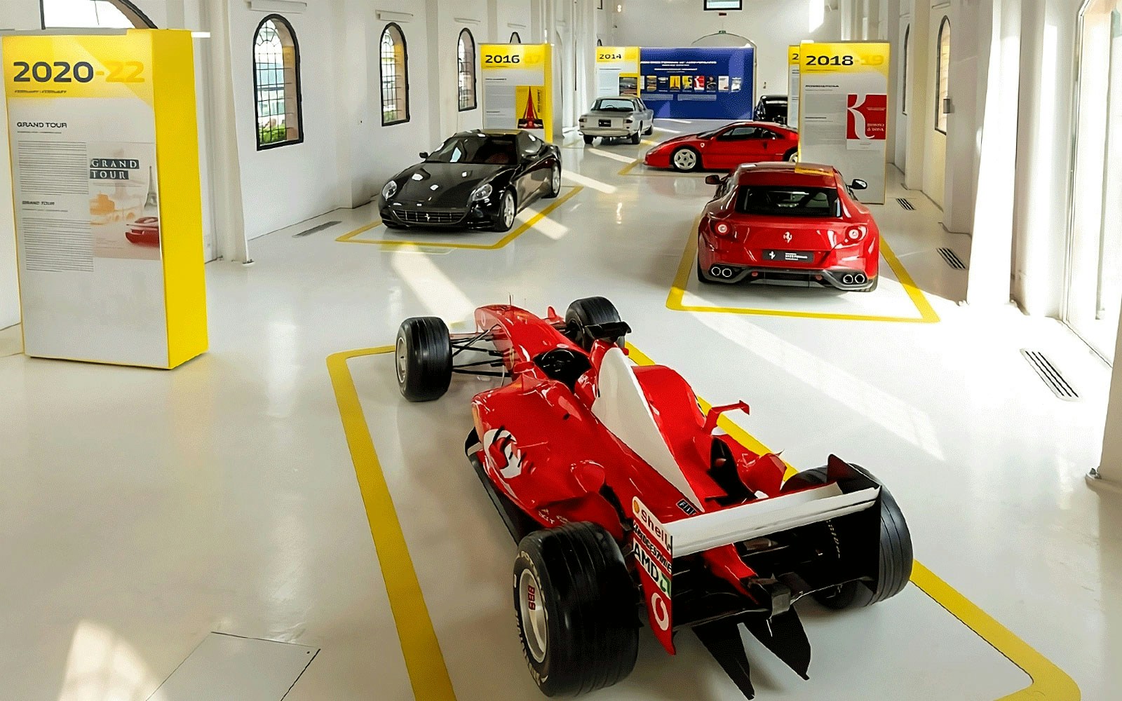 Ferrari cars exhibit at Ferrari Museum, Maranello featuring various models.