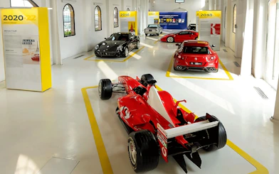 Ferrari cars exhibit at Ferrari Museum, Maranello featuring various models.