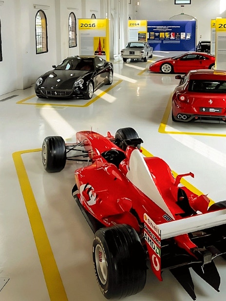 Ferrari cars exhibit at Ferrari Museum, Maranello featuring various models.