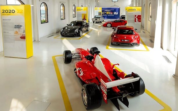 Ferrari cars exhibit at Ferrari Museum, Maranello featuring various models.