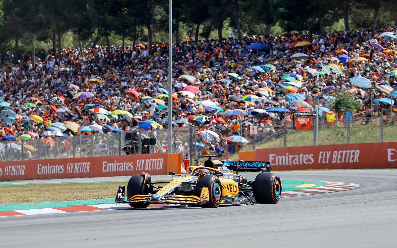 F1 car racing on a track in Barcelona, Spain.