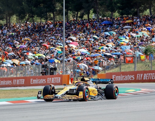 F1 car racing on a track in Barcelona, Spain.